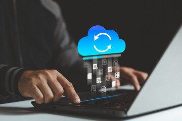 Transfer files data system relocation on cloud system technology concept. Business person hand using laptop computer waiting for transfer document file process with loading bar icon on virtual screen.