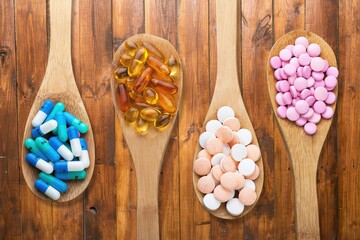 Wall Mural - Vitamin capsules in spoon, Fish oil capsules, vitamin