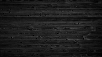 Poster - A black background with a wood grain pattern. The wood grain is clearly visible in the background, giving the image a natural and rustic feel
