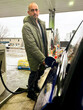 © tessy morelli/Stocksy - UGC man filling up the car at gas station