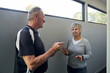 © Rowena Naylor/Stocksy - Building Inspector in discussion with client