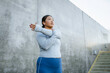 © DZ FILM/Stocksy - A woman does exercises outdoors