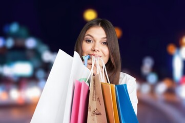 A stylish young woman hold shopping bags