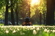 © PP Creative - A person in overalls mowing a large public park with a riding lawnmower