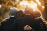 Families Embracing in Grief at a Funeral Service Together