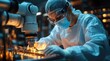 © alva studio - Female technician in cleanroom suit using microscope and robotic arm during microchip manufacturing.