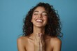 © Pixelpulse Creative  - Young adult smiling Latin woman holding hands on chest expressing gratitude