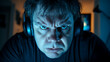 © brenda - Intense middle-aged Caucasian man wearing headphones, focused on a screen, illuminated by cool blue light, conveying determination and concentration in a modern environment.
