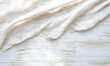 © BehikeChanel - Elegant off-white linen fabric draped on a rustic white wooden background. Perfect for blogs, websites, and design projects needing a textured backdrop.