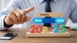 © Nikolai - Progress and transition from 2024 to 2025 concept. A person pointing to loading bar transitioning from 2024 to 2025, progress, future planning, and new year goals. annual planning generated  AI