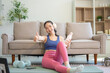 © NINENII - fitness ,workout, home exercise ,lifestyle and healthy concept.Woman in exercise gear.