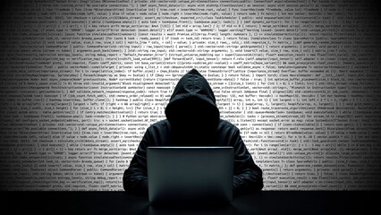 Hacker working on laptop on abstract digital background