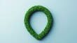 © Jeannaa - A green, grass-shaped location pin on a light blue background, symbolizing eco-friendliness and nature in mapping or navigation.