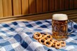 © Alla - A photo of a mug of beer and pretzels on a table, perfect for food or drink related content