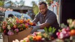 © Дмитрий Прудник - Florist Delivering Vibrant Floral Arrangements from Van to Local Shop in Bright Morning Light