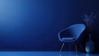 © Steven - Modern blue chair and vase with minimalistic decor against a deep blue wall, creating a serene and stylish atmosphere.