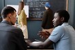 © Seventyfour - Side view of young African American boy working in pair with fellow student practicing new vocabulary in collaborative task, while improving speaking skills in class at English language school