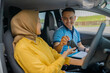 © Odua Images - A driving lesson is exchanged between the instructor and student inside the car