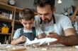 © Milos - A nurturing father engages his son in creative model-building, enhancing their relationship while surrounded by various airplane models in a cozy workshop setting.