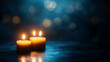 © LunaStar - Three lit candles with soft bokeh background