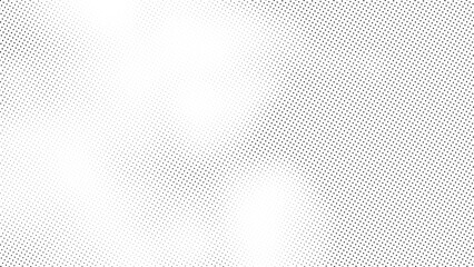 abstract halftone pattern texture with black dots arranged in a fading gradient across a white backg