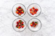 © arinahabich - Fresh and Moldy Strawberries in a Glass Bowl on a White Napkin