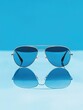© Alexandr - Blue surface with sunglasses
