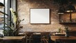 © musa - Blank square frame on brick wall in cafe interior.
