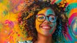 © Saira - Smiling Black woman with colorful face paint against a vibrant backdrop.