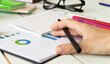 © Pawel - Closeup of female financial adviser looking at graphs.
