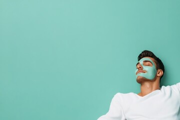 Man relaxing with a green face mask in a tranquil indoor setting