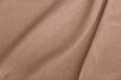 © Viktoriia - Aesthetic neutral background in trendy color of 2025 year, soft crumpled warm mocha brown linen fabric backdrop with natural shadows
