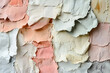 © Vlad - A layered collage of torn paper textures in soft pastels and bold contrasting shades. Paper texture background. AI generated.