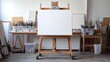 © azi - Blank canvas on easel in artist's studio.