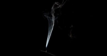 Wall Mural - Real smoke on a black background. Thin Flexible Trickle of Real Smoke. Colorful real smoke rises up. Ideal for background or over-layer with blending mode add, screen, lighten.
