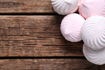 Wall Mural - Delicious marshmallows on wooden background. Top view