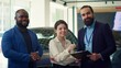 © DC Studio - Portrait of happy car dealership salesman meeting with customers to discuss their needs, promoting sales offers and participating in test drives with interested customers, camera A