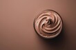 © alexaphotoua - Top view of mocha mousse dessert, soft brown background. Color trend concept, tasty banner with place for text
