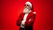 © schiers_images - Santa Claus stands confidently wearing stylish sunglasses against a bright red background, embodying a cool and modern holiday spirit. Perfect image for holiday promotions or contemporary Christmas th