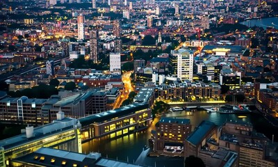 Wall Mural - Camera fly above the city of London at night