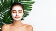 © arisa - Woman with Face Mask and Tropical Leaves
