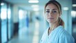 © ali - nurse in white coat in hospital corridor with natural light