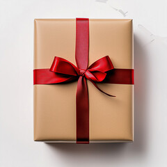 Thoughtfully wrapped gift box adorned with a striking red ribbon, ready for a special occasion
