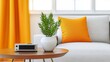 © Mimercy - A cozy living room featuring a bright orange cushion, a green plant, and a stylish side table with modern decor elements.