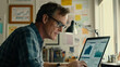 © Niams Haus - Focused businessman at desk with financial documents and laptop displaying earnings reports, conveying determination and attention to financial data analysis.