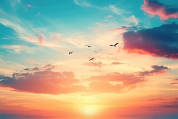 Wall Mural - Birds fly against a vibrant sunset sky. Perfect for peace, travel, or freedom themes.