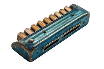 Vintage Blue Harmonica: A weathered teal harmonica, showcasing its aged patina and intricate details. This antique musical instrument evokes a sense of nostalgia and history.