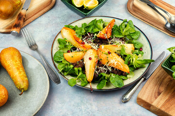 Wall Mural - Salad with liver, caramelized pear in a plate.