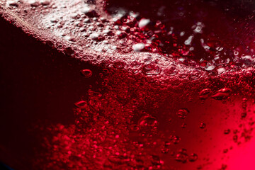 Wall Mural - Red wine abstract splashing in glass.