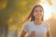 © PRASANNAPIX - young indian woman jogging at park